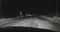 Driving by car on the night roads at winter front view