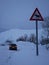 Driving a car in north of Norway - deer road sign and a car