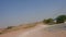 Driving a car in the sandy desert UAE in the Middle East near camel farms. Fast footage clip, fast-f