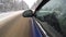Driving by car in the winter on a country road. side view rear view mirror