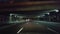 Driving City Highway During the Evening.  Driver Point of View POV Urban Interstate at Night.  Freeway or Motorway or Turnpike