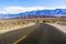 Driving through Death Valley National Park on clear morning, California