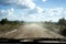 Driving on a dirt road to deliver parcels in rural areas of Brazil.