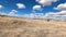 Driving dry arid desert grass sand hills POV 4K