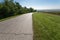 Driving on an empty winding road at sunny day