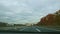 Driving on expressway road among beautiful autumn forest in Frankfurt, Germany