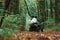 Driving on the footpath. Young couple riding a quad bike in the forest