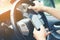 Driving while holding a mobile phone to work ,businessman ,vintage color tone