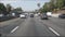 Driving on intercity freeway in Los Angeles, California USA. Defocused view from car thru glass windshield on busy