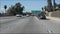 Driving on intercity freeway in Los Angeles, California USA. Defocused view from car thru glass windshield on busy interstate