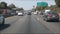 Driving on intercity freeway in Los Angeles, California USA. Defocused view from car thru glass windshield on busy interstate