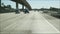 Driving on intercity freeway in Los Angeles, California USA. Defocused view from car thru glass windshield on busy interstate