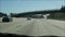 Driving on intercity freeway in Los Angeles, California USA. Defocused view from car thru glass windshield on busy interstate