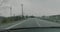 Driving on a Japanese expressway in the rain with the wipers wiping
