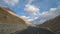 Driving At Ladakh\'s Mountain Roads with Spectacular View of Mountains and Clouds