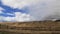 Driving Maui road golden fields blue sky