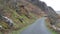 Driving narrow steep road in Snowdonia mountains
