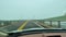 Driving over the Robert Moses Bridge on a foggy afternoon