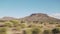 Driving plate side view moving through desert in car with motion blur