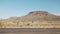 Driving plate side view moving through desert in car with motion blur