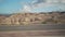 Driving plate side view moving through desert in car with motion blur