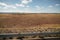 Driving plate side view moving through desert in car with motion blur