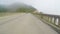 Driving POV: Crossing the historic Bixby Creek Bridge in Big Sur