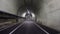 Driving POV: Passing through the Marin Headlands Tunnel on a very foggy evening