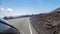 Driving on a road among volcanic landscape of Lanzarote, Canary islands, Spain