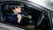 Driving safety. Asian businessman fasten seat belt