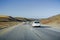 Driving among sand dunes on Highway 1 close to the Pacific Coast, Monterey Peninsula, California