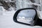 Driving in snow, reflection on the wing mirror