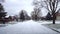 Driving on Snowy Residential Suburb Street in Daytime