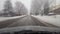Driving Through Snowy Suburb in Daytime With Motion Blur Effect