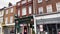 Driving in St Albans in Hertfordshire, England, beautiful English town centre street, historic buildings, shops and