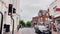 Driving in St Albans in Hertfordshire, England, beautiful English town centre street, historic buildings, shops and