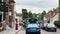 Driving in St Albans in Hertfordshire, England, beautiful English town centre street, historic buildings, shops and