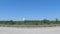 driving street pan distant water tower clear blue sky seen from interstate 95
