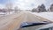 Driving on Suburban Road Post-Winter Storm