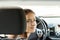 Driving training, student driver in a driving school at a driving lesson behind the wheel of a car,girl gets a driver`s license