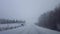 Driving Whiteout Snow Weather on Dangerous Road Conditions in Winter.  Driver Point of View POV Blizzard Snow Storm White-Out