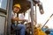 Driving worker heavy wheeled tractor, Wheel loader Excavator with backhoe unloading sand works in construction site