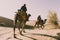 Dromedary with tourist in the thar desert