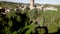 Drone 4K view over green and red vineyards towards the old Castle of Levizzano Rangoni, Emilia Romagna. Italy