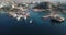 Drone above marina port boats at the sea water or ocean at a desert tropical landscape with hotels and tourist