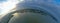 Drone Aerial 360 Degree Panoramic Curved View on Touristic City Located on Spit between Sea and Lake