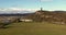 Drone aerial clip flying North East and ascending towards the National William Wallace Monument Stirling Scotland