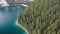 Drone aerial flying over a scenic Lago Di Braies In Dolomites