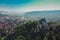 Drone aerial morning panorama of Citadel and Biserica din Deal rising above Sighisoara in Romania. View towards the beautiful  old