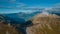 Drone aerial panorama on the Jaufenpass or Passo Giovo in northern italy with beautiful road winding on the mountain and sun just